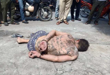 金边一中国纹身男当众失态，遭路人围殴至昏迷